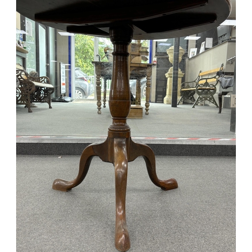 1140 - A George III circular mahogany tilt top tripod tea table, width 76cm, height 72cm