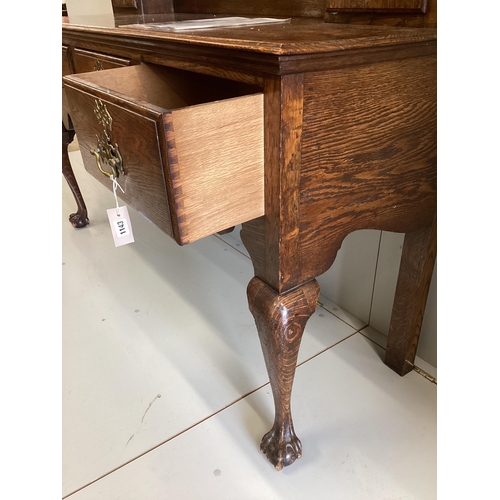 1143 - An 18th century style oak dresser with boarded rack width 148cm,  depth 50cm, height 206cm.