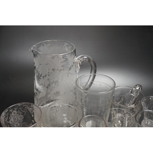 1253 - Fourteen 19th century glass items, including a jug heavily engraved with a scene of a stag in a wood... 