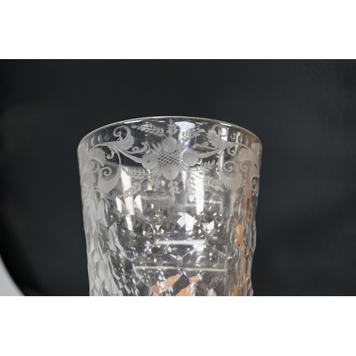 1258 - An English lead crystal 18th century faceted tumbler, in a darkish grey metal, upper decoration engr... 