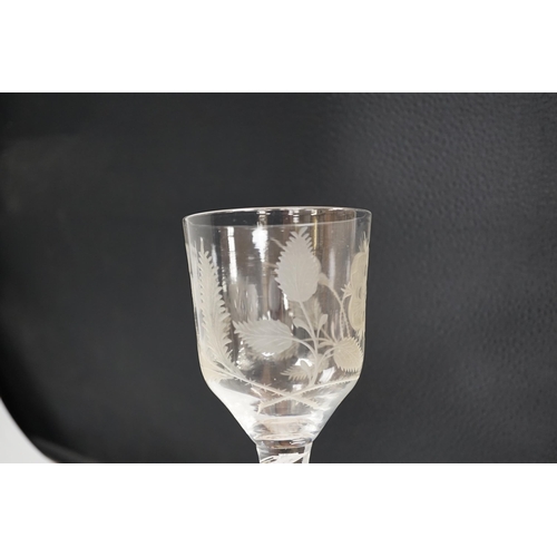 1260 - An English lead crystal Jacobite goblet, c.1750-60, bowl of ogee form, engraved with open and one cl... 