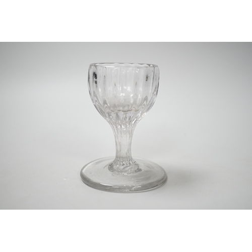 1261 - An English lead crystal dram, mid 18th century, with rib moulded bowl / stem, this rare drawn trumpe... 