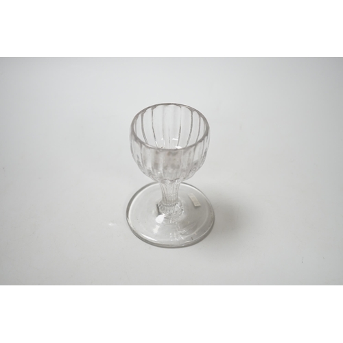 1261 - An English lead crystal dram, mid 18th century, with rib moulded bowl / stem, this rare drawn trumpe... 