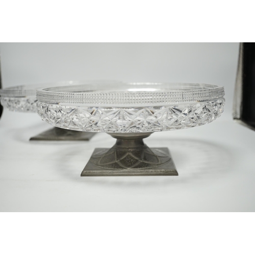 1293 - A pair of Tudric pewter based tazza with cut glass bowls,  bowls 28cm diameter