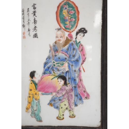 1298 - A framed Chinese porcelain plaque decorated with figures and calligraphy, overall 40cm x 29cm