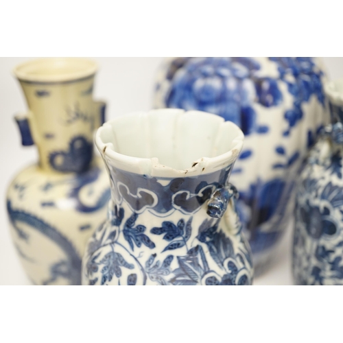 1299 - Three 19th century Chinese blue and white vases including a floral pair and a Japanese vase, largest... 