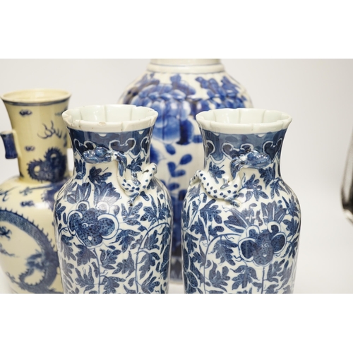 1299 - Three 19th century Chinese blue and white vases including a floral pair and a Japanese vase, largest... 