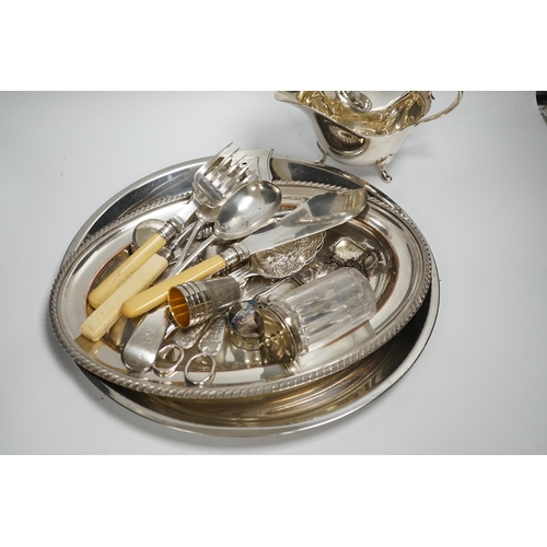 1304 - A small quantity of silver plate, two sauce boats, spirit labels, circular tray, etc.