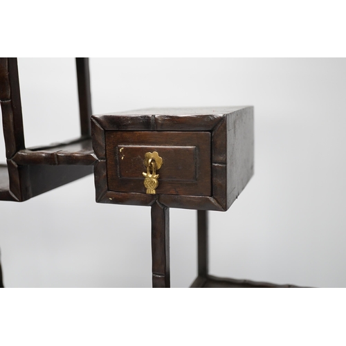 1314 - An early 20th century Chinese hongmu display shelf with cupboard and drawer, 46cm high