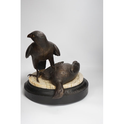 1315 - A limited edition bronze bird of prey with a kill, on a faux marble disc and painted wooden stand, 2... 