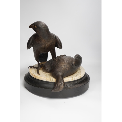 1315 - A limited edition bronze bird of prey with a kill, on a faux marble disc and painted wooden stand, 2... 