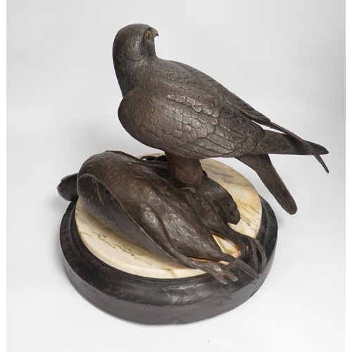 1315 - A limited edition bronze bird of prey with a kill, on a faux marble disc and painted wooden stand, 2... 