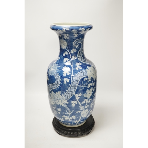 1317 - A Chinese blue and white baluster vase decorated with dragons and flowers together with an unassocia... 