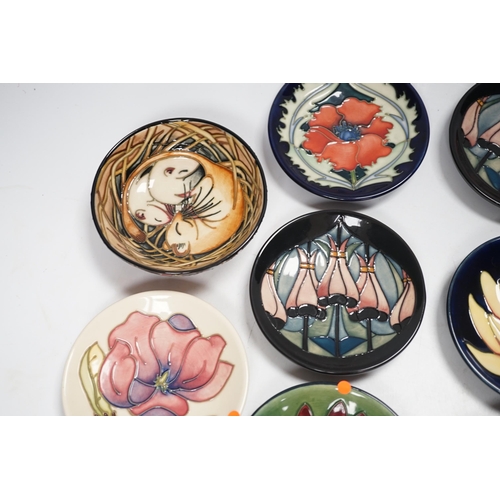 1323 - Seven Moorcroft floral dishes, two with Kerry Goodwin stamp to the base and a dormouse bowl designed... 