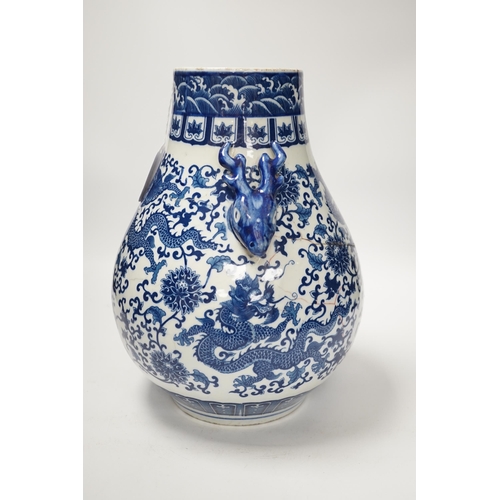 1352 - A Chinese blue and white hu vase with deer head handles, 29.5cm