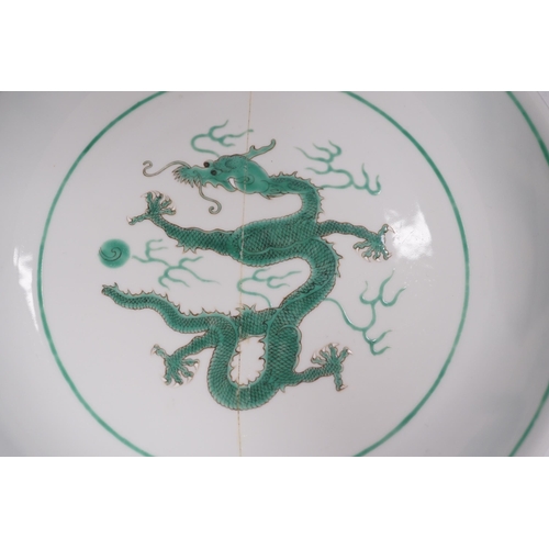 1356 - A Chinese green enamelled porcelain dragon dish, 24cm in diameter (a.f.)