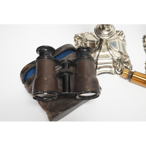 1357 - A brass single draw telescope, cased opera glasses, a pair of plated candlesticks, etc.