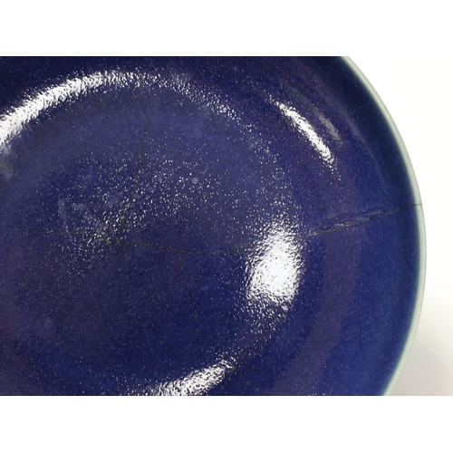 1359 - A Chinese blue glazed dish, Yongzheng mark but later, 22.5cm diameter