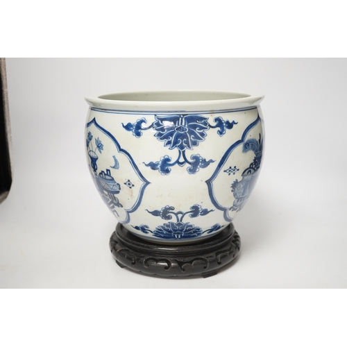 1364 - A Chinese blue and white jardiniere and hardwood stand, total height 23cm