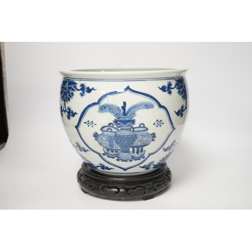 1364 - A Chinese blue and white jardiniere and hardwood stand, total height 23cm