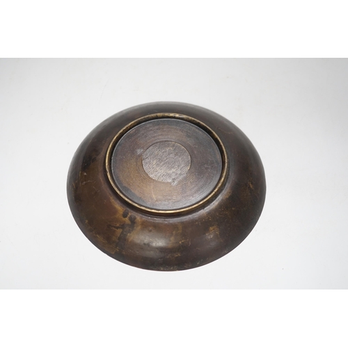 1378 - A Chinese bronze dish, 'coin' design to the centre, 18cm diameter