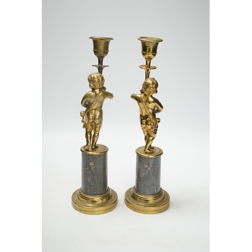 1381 - A pair of brass figural and candlesticks, 27cm high