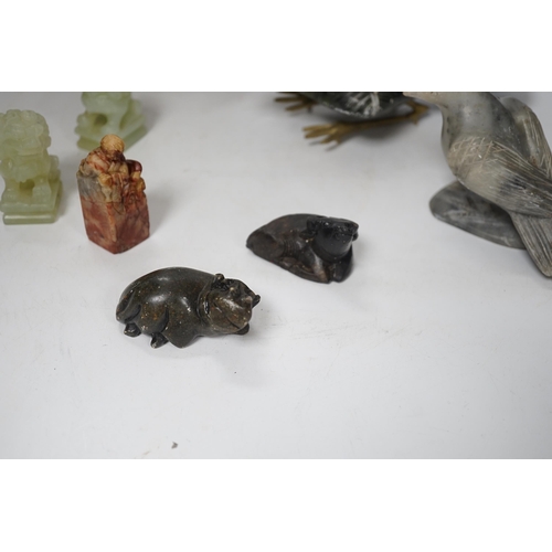 1385 - A group of Chinese soapstone and bowenite animal figures and a figural seal, largest 25cm wide (8)... 