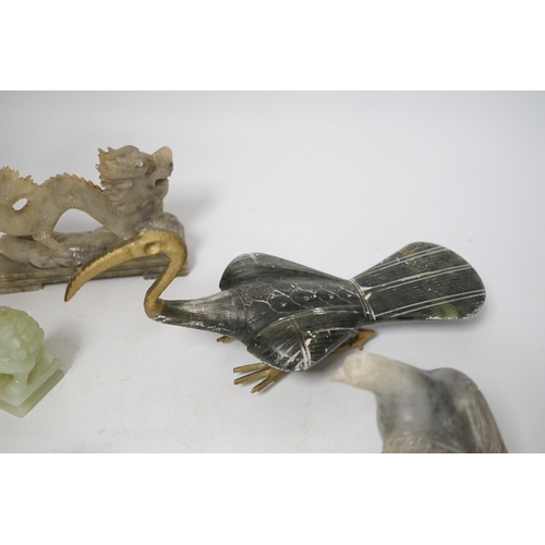 1385 - A group of Chinese soapstone and bowenite animal figures and a figural seal, largest 25cm wide (8)... 