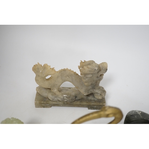 1385 - A group of Chinese soapstone and bowenite animal figures and a figural seal, largest 25cm wide (8)... 