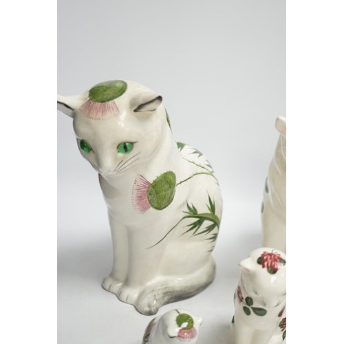 1408 - A Plichta clover pattern cat, a Plichta thistle pattern cat, together with two small Plichta cats an... 