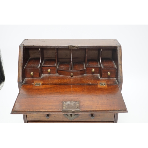 1416 - A George II miniature mahogany bureau with fitted interior and three drawers, 27cm high