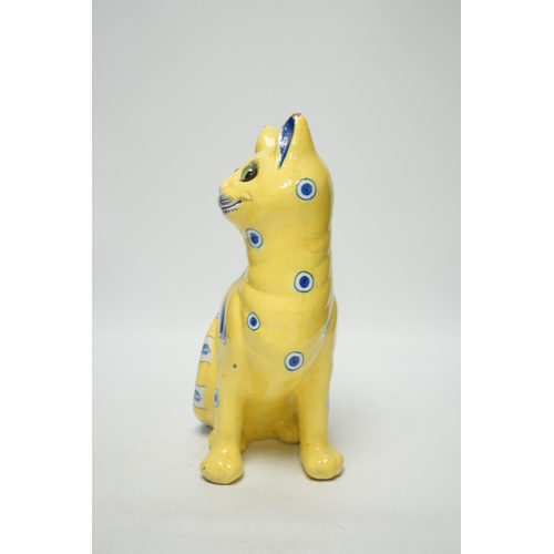 1417 - A Gallé yellow glazed model cat with glass eyes, signed E. Gallé, Nancy, 32cm high