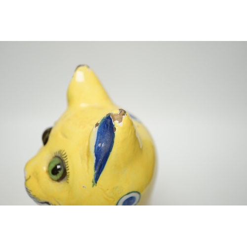 1417 - A Gallé yellow glazed model cat with glass eyes, signed E. Gallé, Nancy, 32cm high