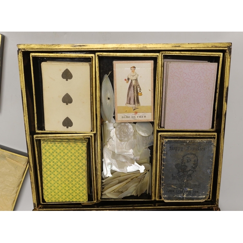 1421 - A mid 19th century Chinese export gaming set with mother of pearl counters, contained in a mid 19th ... 