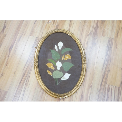 1448 - An oval framed cross stitch embroidery of a lily, indistinctly signed and dated, 80cm x 54cm