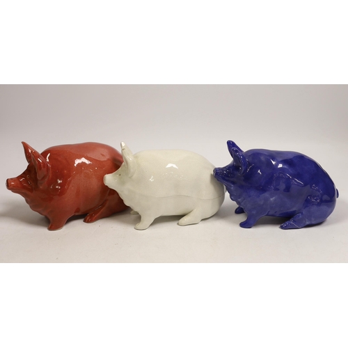 1476 - Three Wemyss ware pigs in cream, blue and pink glazes, 15cm