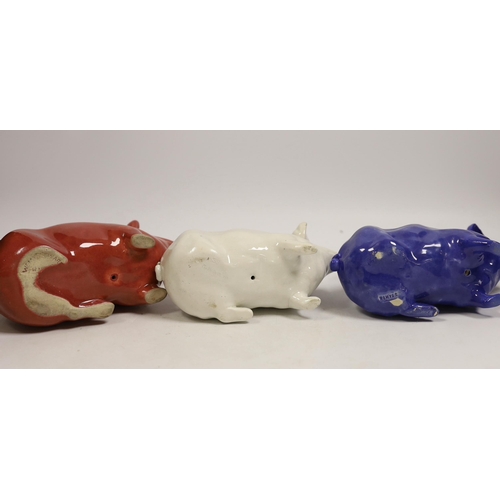 1476 - Three Wemyss ware pigs in cream, blue and pink glazes, 15cm