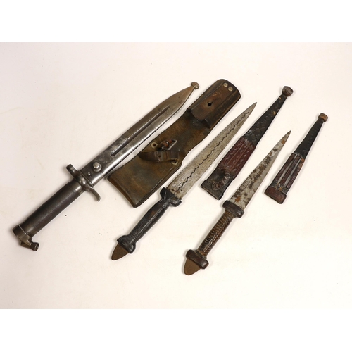 1490 - A Swedish Mauser bayonet and two North African daggers