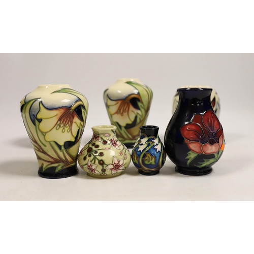 1493 - Seven small Moorcroft vases, various patterns. Tallest 10cm