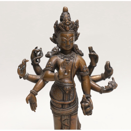 1494 - A Nepalese copper alloy figure of Amoghapasha, 18th/19th century, 19cm high