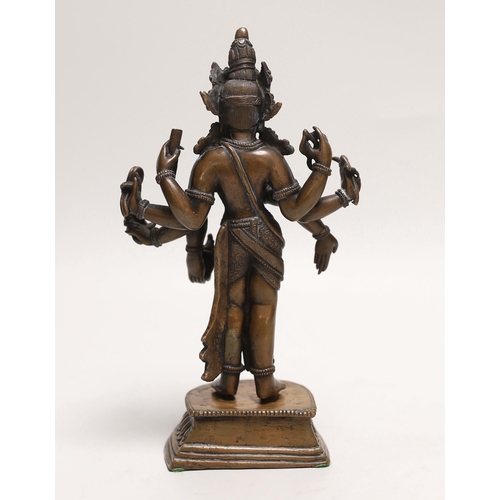 1494 - A Nepalese copper alloy figure of Amoghapasha, 18th/19th century, 19cm high