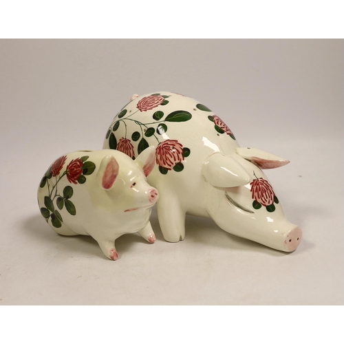 1513 - A Plichta rose decorated pig money box, 16cm, and a Plichta rose decorated hatpin holder pig, 23cm a... 