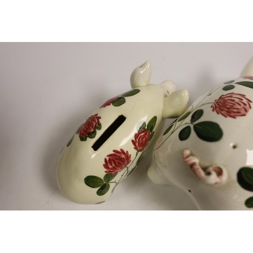 1513 - A Plichta rose decorated pig money box, 16cm, and a Plichta rose decorated hatpin holder pig, 23cm a... 