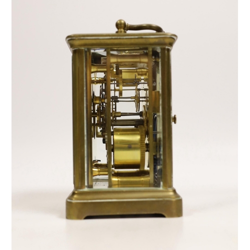 1514 - A brass carriage timepiece with travelling case, 11cm