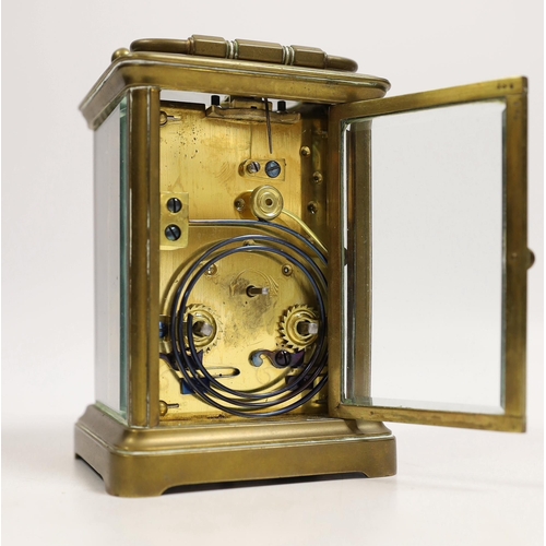 1514 - A brass carriage timepiece with travelling case, 11cm