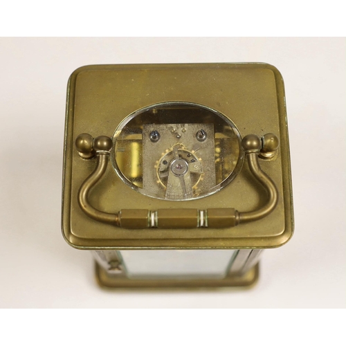 1514 - A brass carriage timepiece with travelling case, 11cm