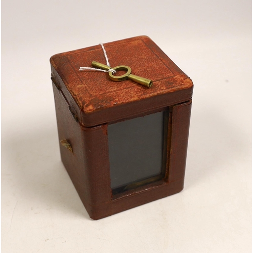 1514 - A brass carriage timepiece with travelling case, 11cm