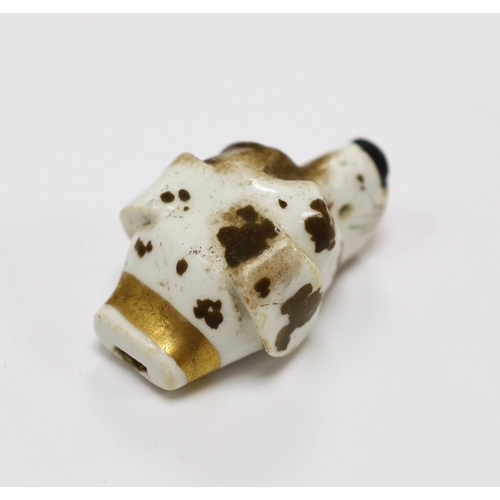 1530 - An early 19th century Staffordshire porcelain dogs head whistle, 4.5cm