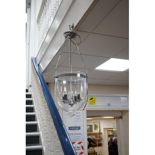 1561 - A pair of chrome plated and glass hanging lanterns