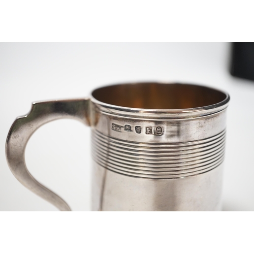 1855 - A George III reeded silver christening mug, Stephen Adam I, London, 1801, 85mm.